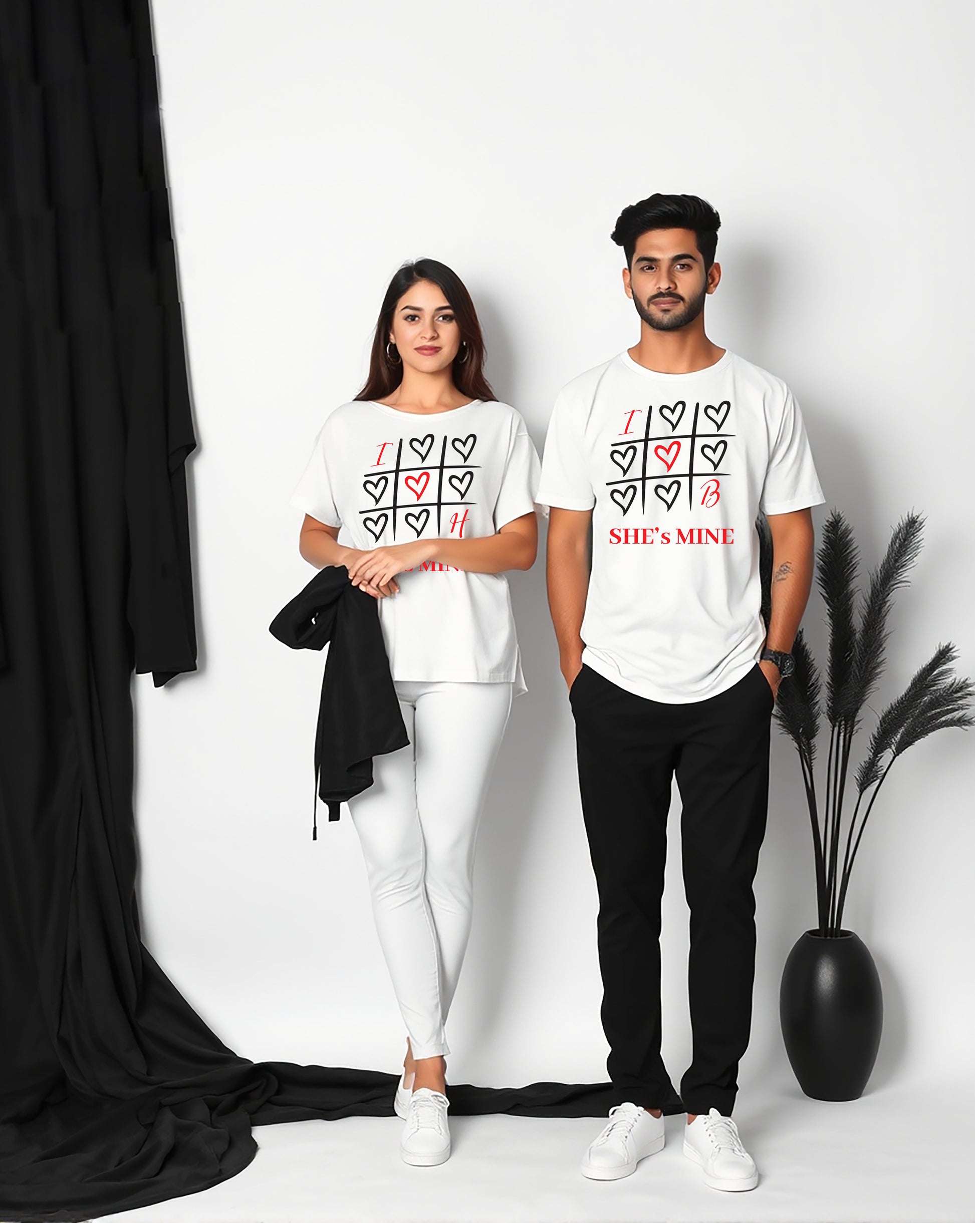 Matching couple T-shirts in white with 'I ❤️' and 'SHE'S MINE' text designs. Stylish and comfortable couple tees for a coordinated look.