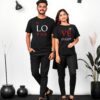 Matching couple T-shirts in black with 'Love Forever' design. Stylish and comfortable apparel for couples, available online in Pakistan.